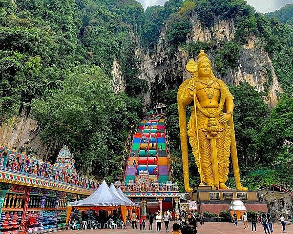 Batu Caves golden Murugan statue and colourful steps near Kuala Lumpur